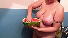Busty milf bathes in warm piss shower, wet curves glistening in tub