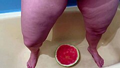 Busty milf bathes in warm piss shower, wet curves glistening in tub