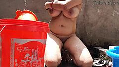 village bhabhi bathes outdoors flashing big tits juicy pussy at ranch