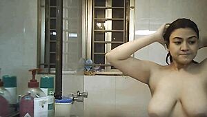 hidden voyeur captures indian bbw with big tits bathing in shower.