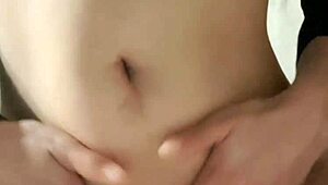 Horny brunette masturbates wet pussy until squirting all over natural boobs