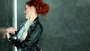 Redhead eurobabe handles gloryhole cock with skill