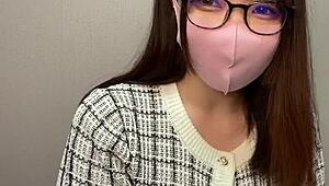 Asian girl masturbates in glasses