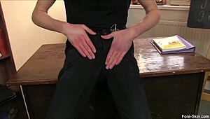 Young gay twink strokes his uncut cock solo