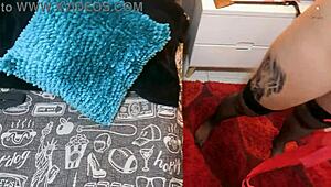 Redhead receives help from boyfriend with a toy