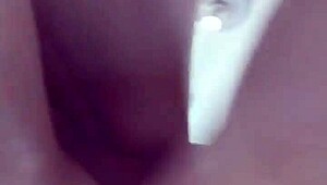 Amateurs bathing in shower bent over.