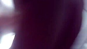 Amateurs bathing in shower bent over.