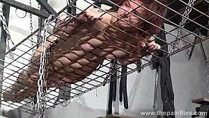 redhead amateur slavegirl in metal bondage