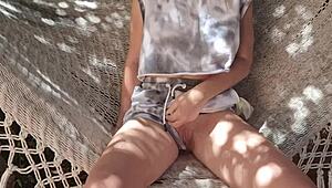 shy amateur enjoys solo outdoor activity in the garden