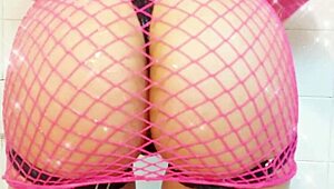 She slips into sexy fishnet lingerie