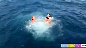 Brooke and friend kiss nude on boat during steamy vacation. Teasing turns into lesbian play outdoors.