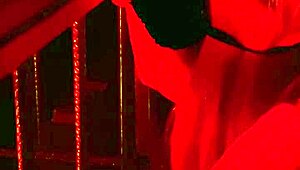 Handcuffed blonde endures hot wax backstage