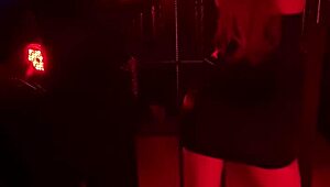 Handcuffed blonde endures hot wax backstage