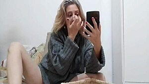 Blonde milf puts ball in mouth, pretends sucking.