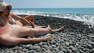 Stranger gives hot handjob in public beach