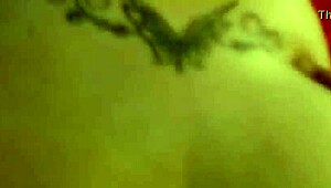 In the dimly lit room, a thick white ass bends over for intense anal fucking in doggystyle position