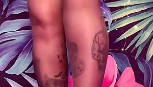 Woman teases in pantyhose and latex dress with tattoos.