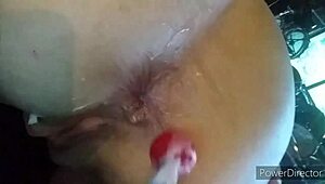 scorpio and capricorn engage in intense fisting session involving candy for added pleasure.