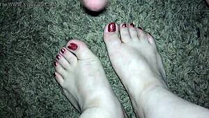 Wow, sexy cumshot on slut's beautiful feet with red toenails!