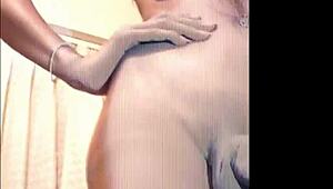 ladyboy with big tits teases in a hot striptease