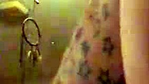 In this retro blue film, a tattooed performer engages in intense riding