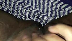 Brunette woman relaxing and touching herself gently