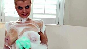 'Nadia White masturbates her pussy in the bath, showing off her big tits?'