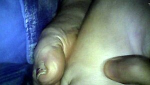 BBW wife gives footjob leading to cumshot