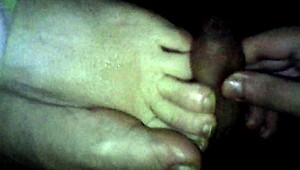 BBW wife gives footjob leading to cumshot