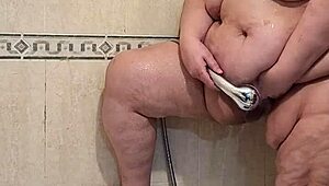 Intriguing mature woman pees and gets fucked by her dildo