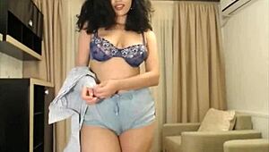 This adorable latina girl on webcam starts fucking her ass hard