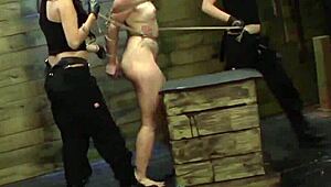 Redhead lezdom feels intense pleasure as strapon fucks her in rough trio