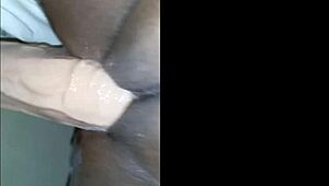 Juicy pussy gets stretched by big hard plastic cock in anal play.