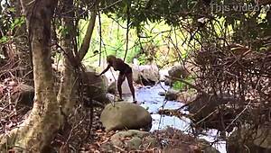 Nina Rivera boldly sucks a massive black cock by the riverside, embracing her girl-next-door charm with intense passion.