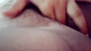 Happy New Year! Curly milf fingers her vagina solo