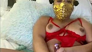 Masked Ebony Freak Talks Dirty While Squirting with Vibrator