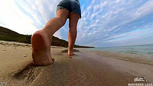 Follow wrinkled feet on sandy beach