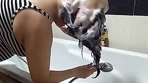 look at regina noir nude in the shower washing her hair as voyeur