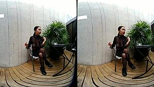 young girl smokes topless in leather skirt