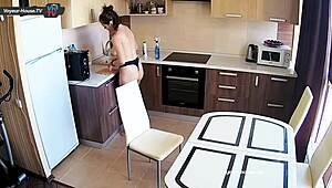 The big tits beauty cleans the kitchen.