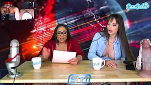 Camsoda Live: Lesbian Milfs Riding Sybian to Intense Orgasm on Air While Reading News with Big Tits Bouncing Wildly.