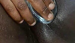 ebony babe squirts hard while playing solo with a dildo.