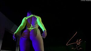 latina babe dances in panties, showing off her natural tits on webcam.
