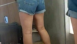 Sex in the store's changing room with a butt plug!