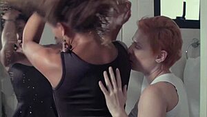 Emme White and Giovana Bombom get naughty with fingering in a hotel room.