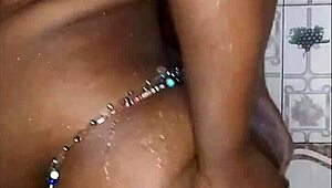 The black thick ebony woman fucks and dances in the shower