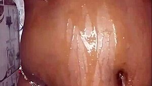 The black thick ebony woman fucks and dances in the shower