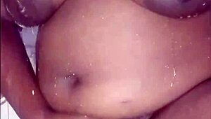 The black thick ebony woman fucks and dances in the shower