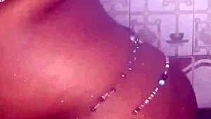 The black thick ebony woman fucks and dances in the shower