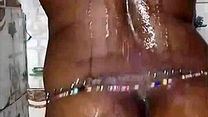 The black thick ebony woman fucks and dances in the shower